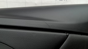The front right door panel of the Chevrolet Volt 16 is black, with a black leather insert, the armrest is black leather, with a handle, without a cover and buttons, scratches