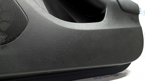 The front right door panel of the Chevrolet Volt 16 is black, with a black leather insert, the armrest is black leather, with a handle, without a cover and buttons, scratches