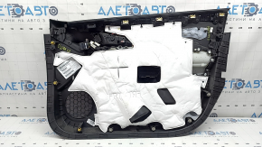 The front left door panel of a Chevrolet Volt 16 is black, with a black leather insert, the armrest is black leather, with a handle, without a trim and buttons, scratches