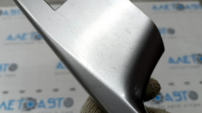 The rear right door window control panel for a Toyota Prius V 12-17 is gray and has some wear and scratches.