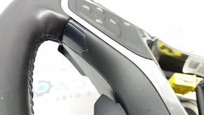 The steering wheel is bare, Chevrolet Volt 16-19, black leather, with buttons, paddle shifters, and heating. The coating is peeling, there are scratches, and scuffs.
