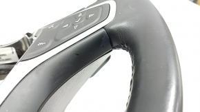 The steering wheel is bare, Chevrolet Volt 16-19, black leather, with buttons, paddle shifters, and heating. The coating is peeling, there are scratches, and scuffs.