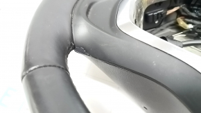 The steering wheel is bare, Chevrolet Volt 16-19, black leather, with buttons, paddle shifters, and heating. The coating is peeling, there are scratches, and scuffs.