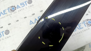 The front left side door trim for a Porsche Macan 15-26 is worn.