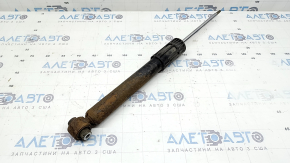 The rear left shock absorber for a VW Tiguan 18-24 AWD is rusty.