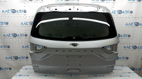 The tailgate is bare with glass, Ford Escape MK4 20-22 silver UX, bumps, and worn glass.