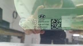 Hyundai Tucson 22-26 central panoramic glass with scratches, soot, and corrosion
