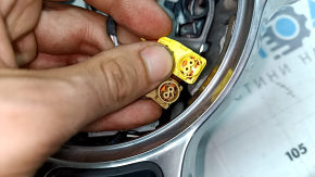 The steering wheel is bare, leather, black, heated, with buttons, paddles, and overlays, and has scratches.
