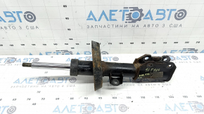 The front right shock absorber for a Chevrolet Volt 16 is rusty.