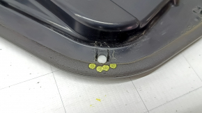 The inner rear right door panel of an Audi A6 C8 19-25 under the door closer, the fasteners are broken