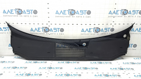 The plastic windshield wiper grille for an Audi A6 C8 19-24 has broken fasteners.