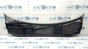 The plastic windshield wiper grille for an Audi A6 C8 19-24 has broken fasteners.