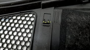 The plastic windshield wiper grille for an Audi A6 C8 19-24 has broken fasteners.