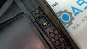The plastic windshield wiper grille for an Audi A6 C8 19-24 has broken fasteners.
