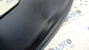 The rear bumper lip of the Audi A4 B9 17-18 s-line is matte and dented.