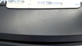 The rear bumper lip of the Audi A4 B9 17-18 s-line is matte and dented.