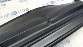 The rear bumper lip of the Audi A4 B9 17-18 s-line is matte and dented.