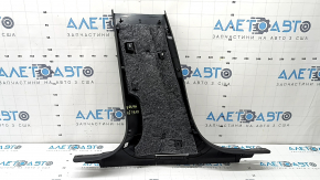 The lower right center pillar trim for an Audi A6 C8 19-25 is black, scratched, the plastic has turned white, and the mount is broken.