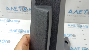 The lower right center pillar trim for an Audi A6 C8 19-25 is black, scratched, the plastic has turned white, and the mount is broken.
