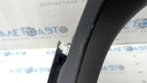 The lower right center pillar trim for an Audi A6 C8 19-25 is black, scratched, the plastic has turned white, and the mount is broken.