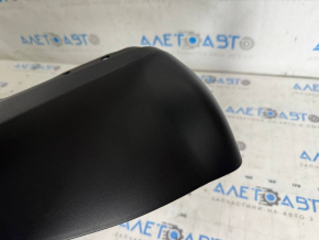 The bare lower rear bumper of the Tesla Model Y 20-25 is dented.