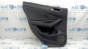 Rear left door panel for a 19-26 VW Jetta, black with black plastic insert, leather armrest, with a tweeter, with a handle, scratches