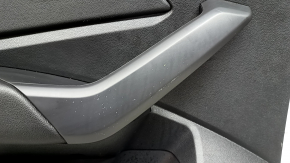 Rear left door panel for a 19-26 VW Jetta, black with black plastic insert, leather armrest, with a tweeter, with a handle, scratches