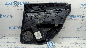 Rear left door panel for a 19-26 VW Jetta, black with black plastic insert, leather armrest, with a tweeter, with a handle, scratches