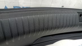 VW Jetta 19-26 trunk opening trim, black, scratches