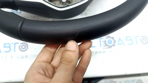 VW Jetta 22-26 black leather steering wheel with radar buttons and a glossy black lower trim