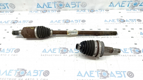 The rear left half shaft of a Ford Escape MK4 20-26 is rusty, the outer CV joint is defective, and the boot is torn.