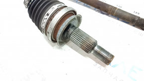 The rear left half shaft of a Ford Escape MK4 20-26 is rusty, the outer CV joint is defective, and the boot is torn.