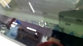The front panoramic glass of a Hyundai Tucson 22-26 has a torn seal, a chip, and a worn coating.