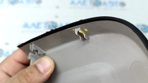 The interior mirror cover for the Audi A6 C8 19-25 is gray and has broken fasteners.