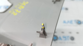 The interior mirror cover for the Audi A6 C8 19-25 is gray and has broken fasteners.
