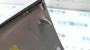 The interior mirror cover for the Audi A6 C8 19-25 is gray and has broken fasteners.