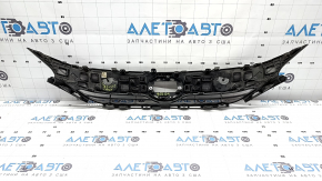 The radiator grille of the Toyota Venza 21-24 is cracked and chipped.