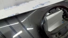 The radiator grille of the Toyota Venza 21-24 is cracked and chipped.