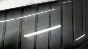 The radiator grille of the Toyota Venza 21-24 is cracked and chipped.