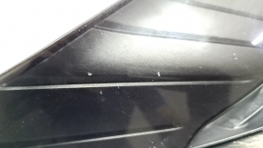 The radiator grille of the Toyota Venza 21-24 is cracked and chipped.