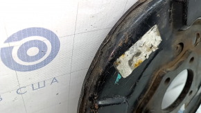 The rear left brake disc cover of a Toyota Camry v55 15-17 USA is dented.