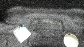 The Audi A6 C8 19-25 trunk liner is worn and torn.