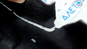 The Audi A6 C8 19-25 trunk liner is worn and torn.
