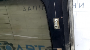 The rear window of a Mazda 3 19-26 4D Japan-built has bulged tint.
