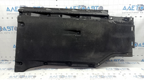 The right underbody protection of the Audi A4 B9 17-25 is worn and broken.