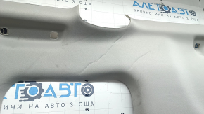 The headliner of a 20-22 Toyota Highlander is gray and has creases under the sunroof. The brackets have come loose and need cleaning.
