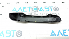 The outer rear left door handle trim of the Audi Q5 80A 18-24 has a crack, scratches, and broken fasteners.