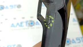 The outer rear left door handle trim of the Audi Q5 80A 18-24 has a crack, scratches, and broken fasteners.