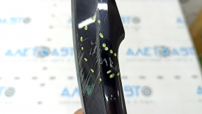 The outer rear left door handle trim of the Audi Q5 80A 18-24 has a crack, scratches, and broken fasteners.