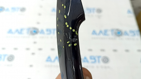 The outer rear left door handle trim of the Audi Q5 80A 18-24 has a crack, scratches, and broken fasteners.